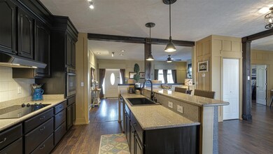 With its granite counter tops, painted cabinetry, granite composite sink and stainless steel appliances, cooking with be a joy here.