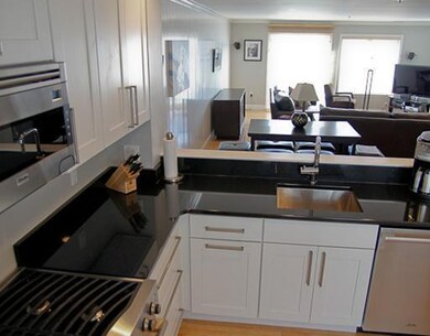 Kitchen. View of living area from...