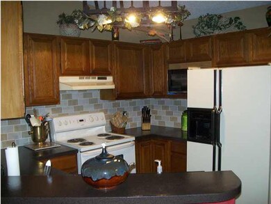 KITCHEN FEATURING NEW TILE BACKSPLASH AND NEW RANG