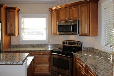 Here's another View of the Kitchen Showing the Stainless Steel Stove, Gorgeous Cabinets and Extra Counter Space!