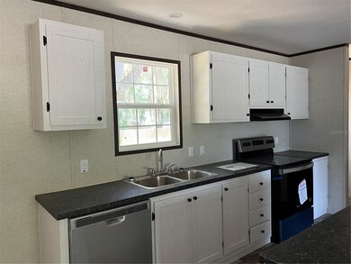 New kitchen with stainless steel appliances