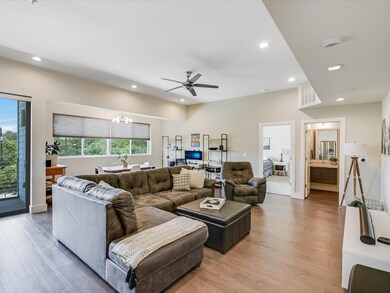 Living area featuring a chandelier, recessed ligh