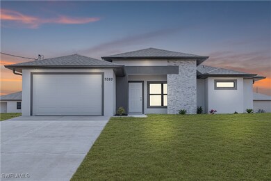 Prairie-style house featuring a garage, stucco sid