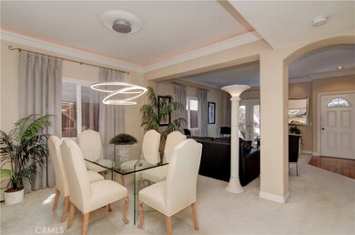 Designer details, including contemporary lighting elements make this large formal dining space a special place to entertain family and friends.