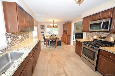The large kitchen area leads into the dining space