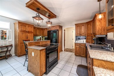 Kitchen with new light fixtures, built in pantry (lots of shelves/space in here).