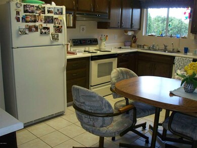 KITCHEN WINDOW LOOKING OUT TO BACK YARD