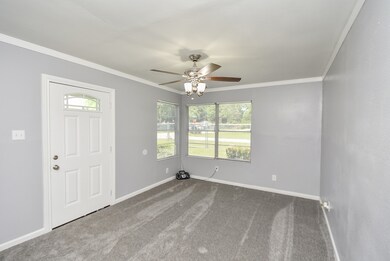 Ceiling Fan and new carpet in the oversized Living Room!