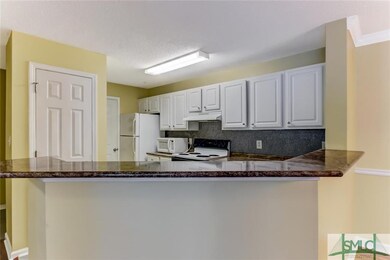 Spacious kitchen is fully applianced and has crisp