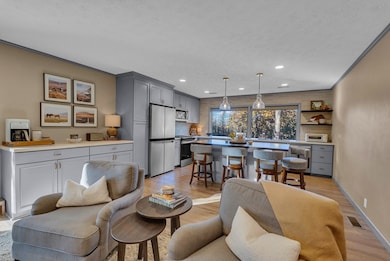 Spacious kitchen with a cozy sitting room.