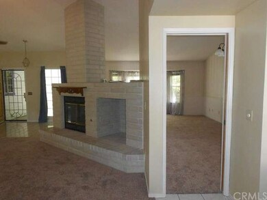 Fireplace island separating family room & formal L