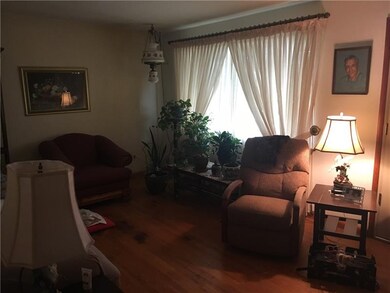 Living room with original hardwood floors and love