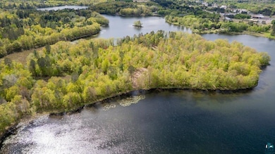 Watch the sun dip below the horizon, casting warm tones over the treetops and waterfront—breathtaking views at your private slice of Northwoods sunsets.