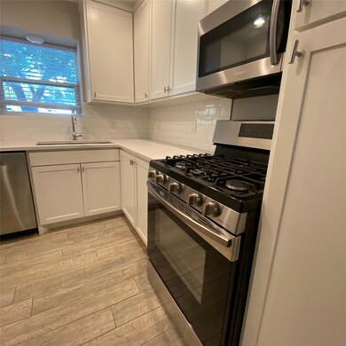 Kitchen featuring appliances with stainless steel