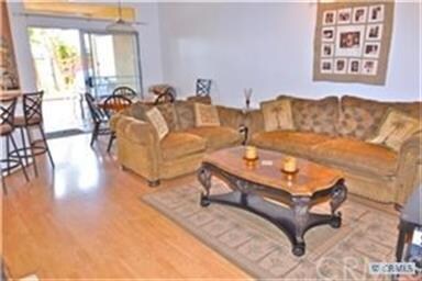 Spacious living room area opens to backyard.