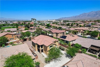 Aerial perspective of suburban area featuring a mountain backdrop