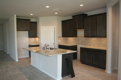 Another view of the kitchen as you enter from the gallery style entry. Stainless appliances to be installed soon!