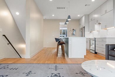 Kitchen featuring tasteful backsplash, a center i