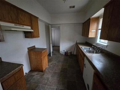 Kitchen with crown molding, white dishwasher, and 