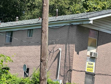 Exterior view of brick siding and roof with shingles