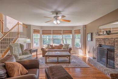 Great room with bayed style windows, hardwood floo