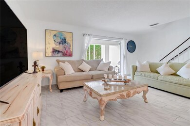 Living room featuring light tile patterned floors