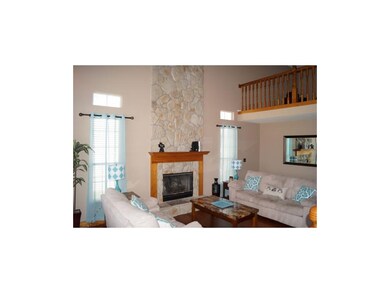 Notice the loft overlooking the living room.  Perf