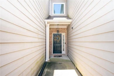 Property entrance with brick siding