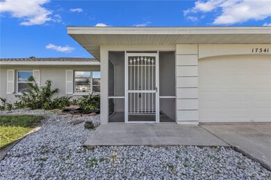 Doorway to property featuring a garage