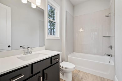 Bathroom featuring shower / bathtub combination and vanity