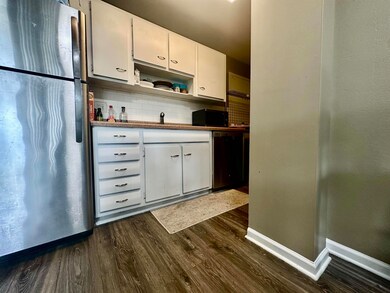 Kitchen featuring dark hardwood / wood-style floor
