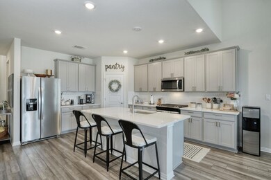 Kitchen featuring stainless steel appliances, a s