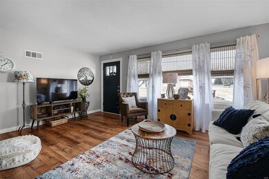 Living room has an abundance of natural light.