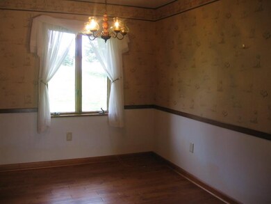 The dining room opens to the living room and featu