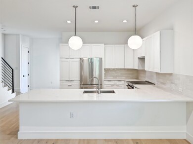 Kitchen with a sink, stainless steel appliances, 