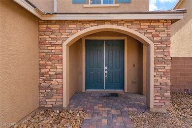 Doorway to property with stucco siding