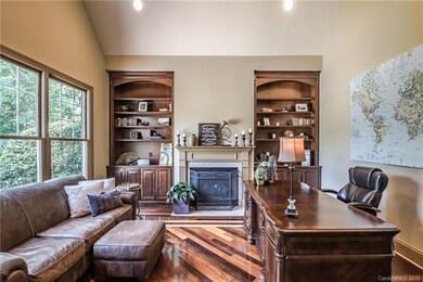 Private study with fireplace, vaulted ceiling and 