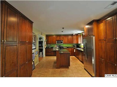 Remodeled kitchen features Kraftmade cabinetry, qu