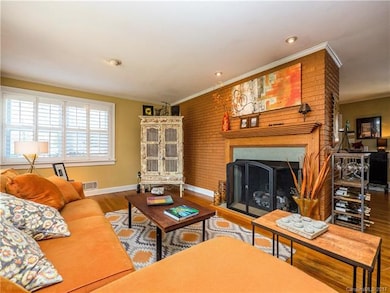 Living Room with gas burning fireplace opens to di