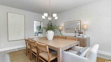 Dining room with an inviting chandelier and light 
