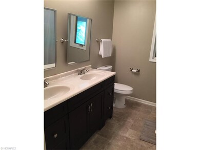 Spacious Main Bathroom with new vanity, fixtures, flooring and shower surround