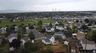 Aerial perspective of suburban area with a mountain backdrop