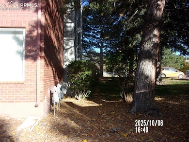 View of side of property featuring brick siding