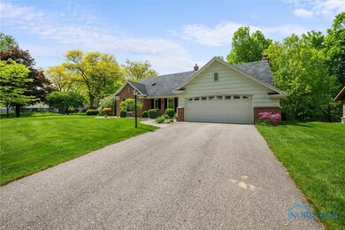 Generous sloping driveway has ample room for multi