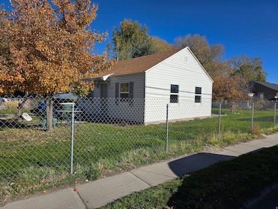 View of side of home featuring a fenced front yard
