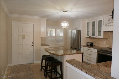 Kitchen with range, tasteful backsplash, stainless
