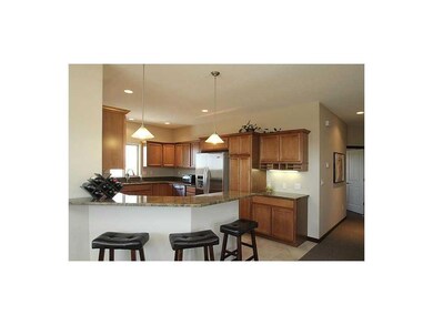 Kitchen. Kitchen opens over breakfast bar to the l