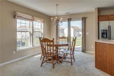 Bright and airy, the dining area off the kitchen also provides access to the patio. 