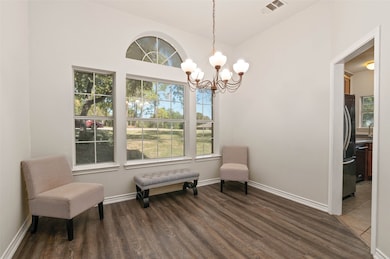 Just off the front entry is a formal dining area or sitting room