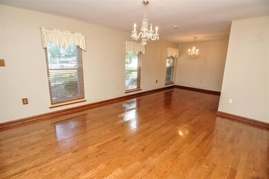 The living room and dining room showcase gleaming 